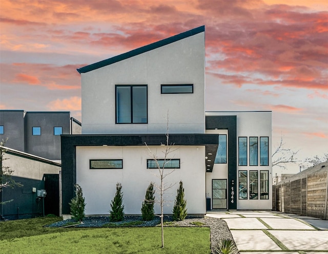 contemporary home featuring stucco siding