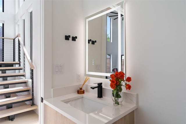 bathroom with plenty of natural light and vanity