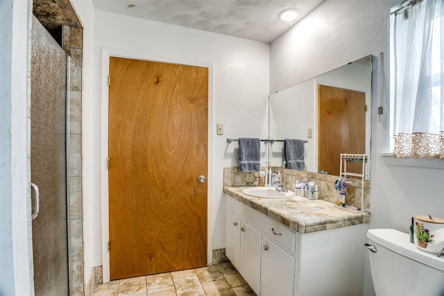 full bath featuring vanity, a shower stall, toilet, and tasteful backsplash