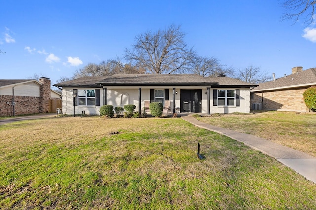 ranch-style home featuring stucco siding, a front lawn, and fence