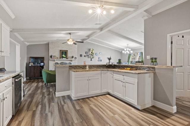 kitchen with white cabinets, dishwasher, lofted ceiling with beams, and wood finished floors