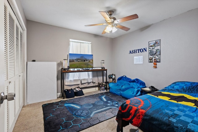 carpeted bedroom with a closet and a ceiling fan