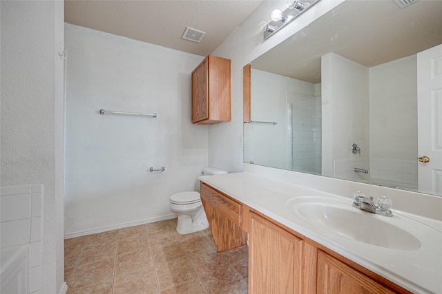 full bathroom with visible vents, toilet, baseboards, walk in shower, and vanity