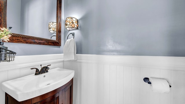 bathroom with wainscoting and vanity