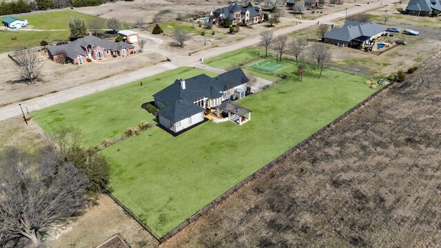 birds eye view of property with a rural view