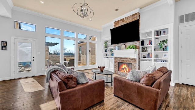 living room featuring a fireplace, wood finished floors, and visible vents