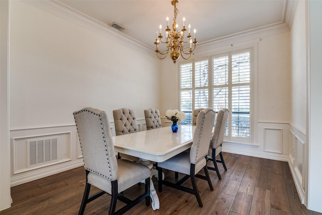 dining area featuring visible vents, a chandelier, dark wood-style flooring, and crown molding