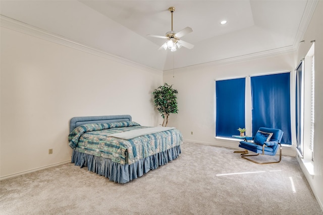 bedroom featuring a ceiling fan, a tray ceiling, recessed lighting, crown molding, and carpet flooring