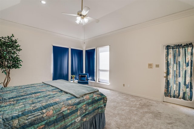 bedroom featuring ceiling fan, baseboards, crown molding, and carpet