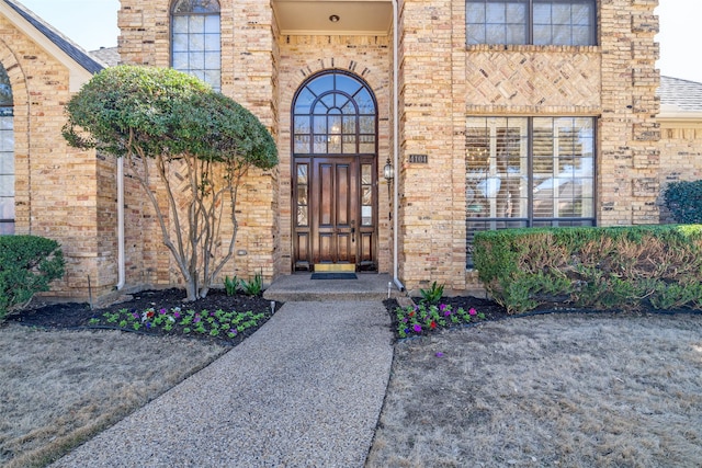 entrance to property with brick siding