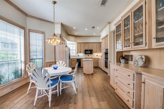 dining area featuring visible vents, dark wood-style flooring, and crown molding