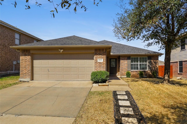 view of front of property with a front lawn, roof with shingles, concrete driveway, an attached garage, and brick siding