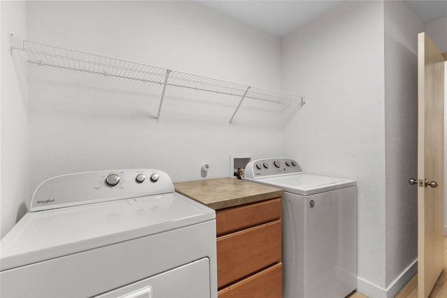 clothes washing area with laundry area and washing machine and clothes dryer