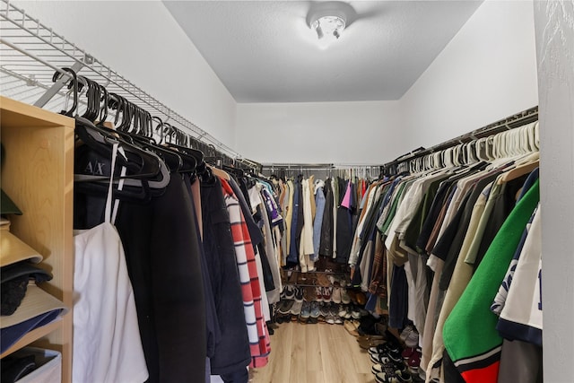 spacious closet with wood finished floors