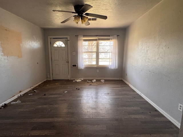 entrance foyer with a ceiling fan, wood finished floors, baseboards, and a textured ceiling