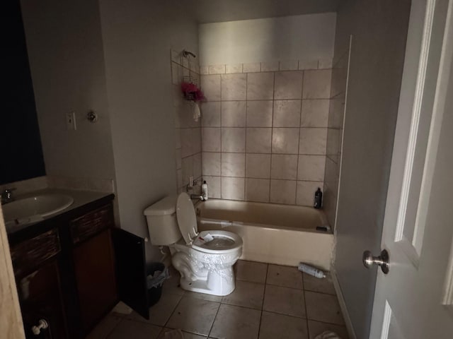 bathroom featuring tile patterned floors, toilet, vanity, and shower / tub combination