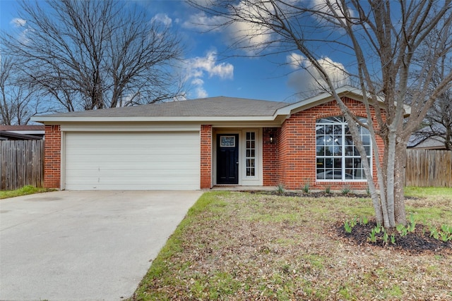 ranch-style home with brick siding, an attached garage, and fence