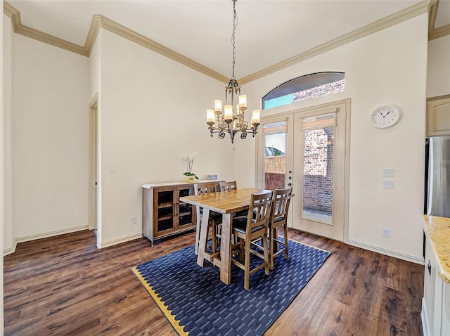 dining area with an inviting chandelier, crown molding, dark wood-style floors, and baseboards