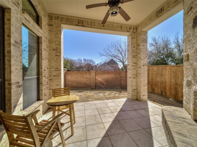 view of patio / terrace featuring a fenced backyard and a ceiling fan