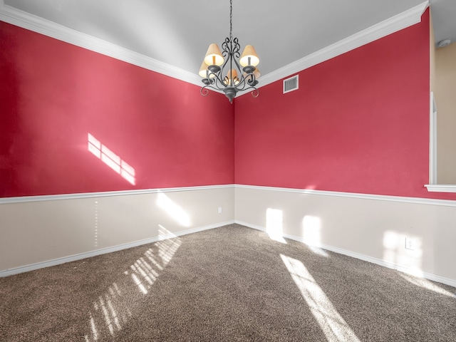 carpeted empty room with visible vents, baseboards, a chandelier, and ornamental molding