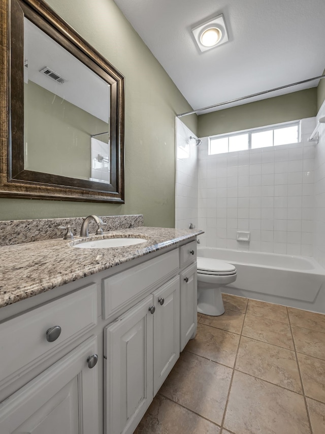 bathroom featuring tile patterned flooring, visible vents, tub / shower combination, toilet, and vanity