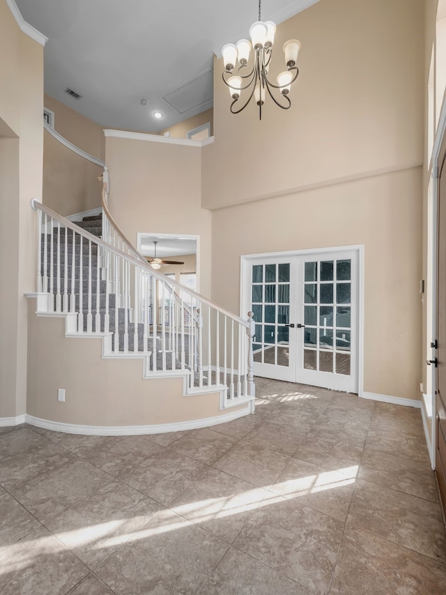 interior space featuring french doors, stairway, a high ceiling, an inviting chandelier, and baseboards