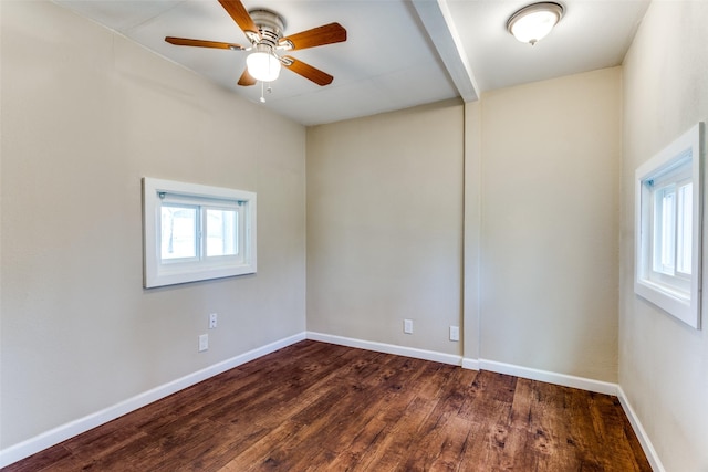 empty room with a ceiling fan, wood finished floors, and baseboards