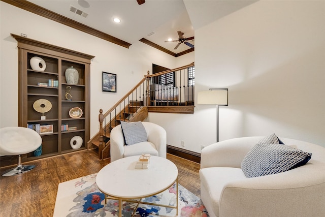 living room featuring stairway, wood finished floors, visible vents, recessed lighting, and crown molding