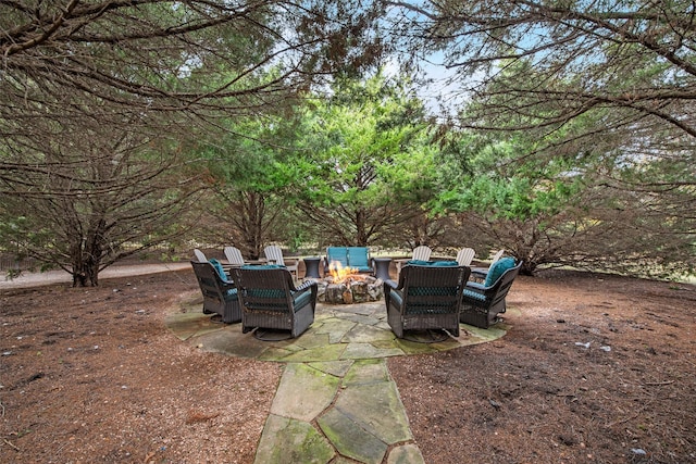 view of patio / terrace featuring an outdoor fire pit