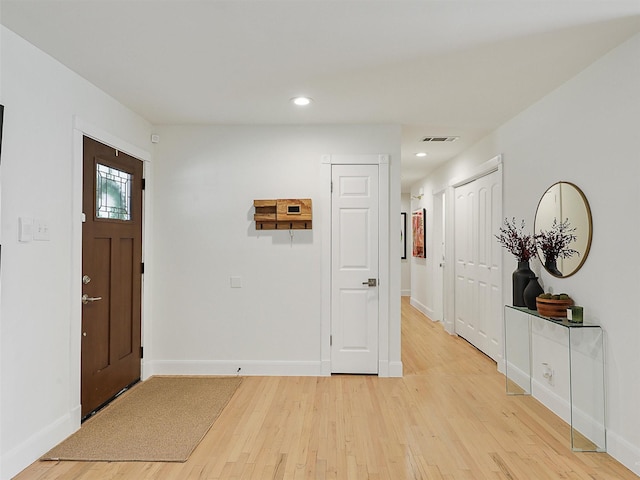 entrance foyer with recessed lighting, light wood-type flooring, baseboards, and visible vents