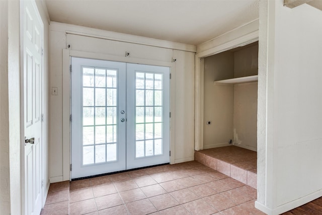 doorway to outside with light tile patterned floors, french doors, and plenty of natural light