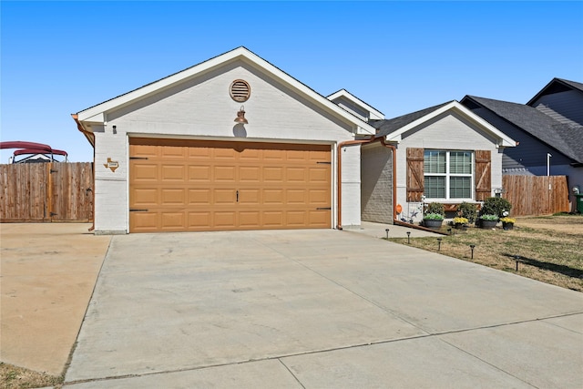 ranch-style home featuring concrete driveway, a garage, fence, and brick siding