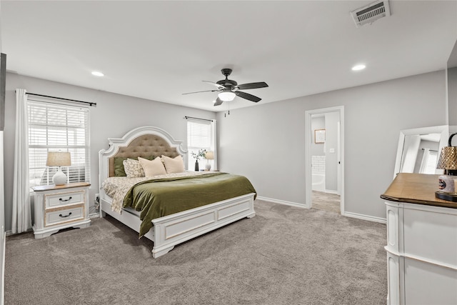 bedroom featuring visible vents, multiple windows, baseboards, and carpet floors