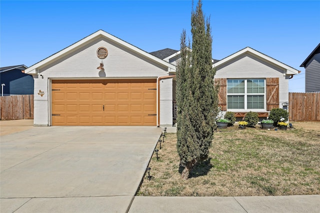 ranch-style home featuring a front lawn, driveway, fence, an attached garage, and brick siding