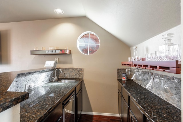 bar featuring wet bar, a sink, vaulted ceiling, wine cooler, and dark wood-type flooring