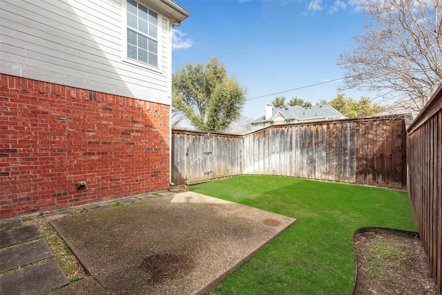 view of yard featuring a fenced backyard and a patio area