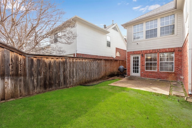 exterior space featuring a fenced backyard and a patio