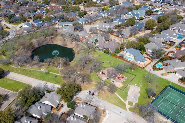 drone / aerial view featuring a residential view and a water view