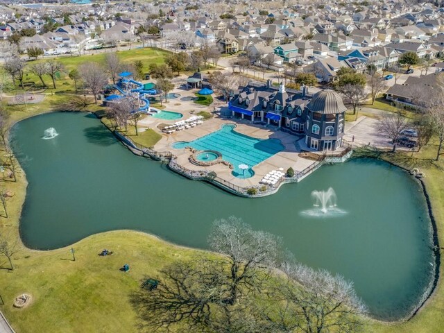 aerial view featuring a residential view and a water view