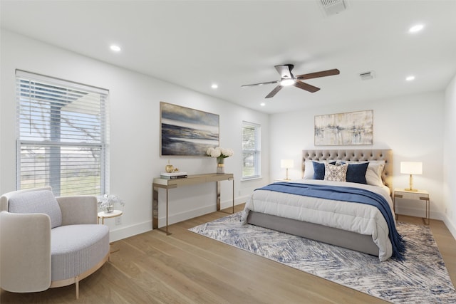 bedroom featuring recessed lighting, wood finished floors, and visible vents