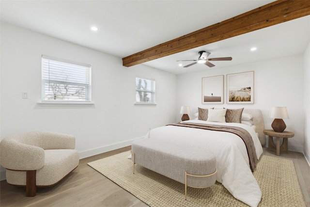 bedroom with beamed ceiling, a ceiling fan, recessed lighting, light wood finished floors, and baseboards