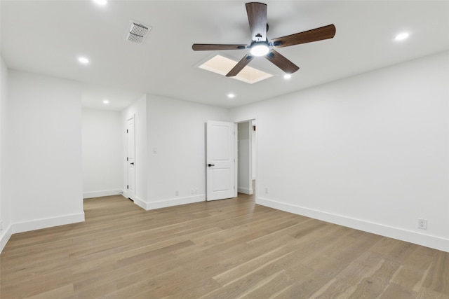 empty room with recessed lighting, visible vents, baseboards, and light wood-style floors