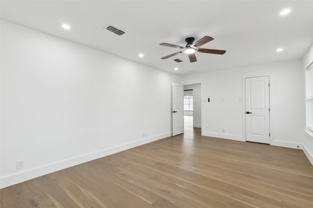 unfurnished bedroom featuring visible vents, recessed lighting, baseboards, and light wood-style floors