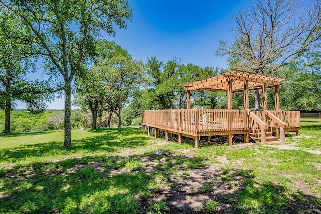 view of yard featuring a wooden deck and a pergola