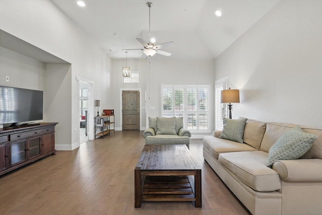 living room featuring recessed lighting, baseboards, a ceiling fan, and wood finished floors