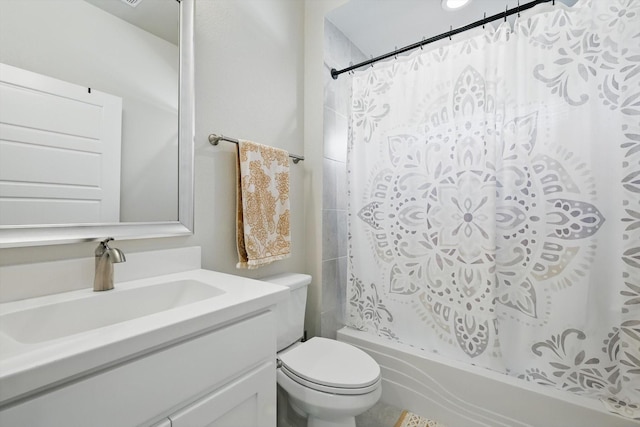 bathroom with vanity, toilet, and shower / tub combo with curtain