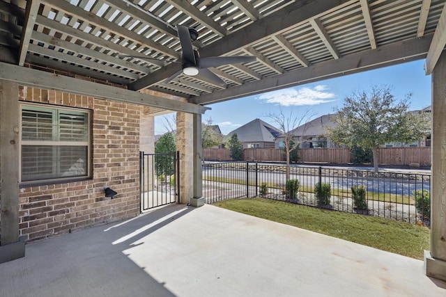 view of patio / terrace with ceiling fan and fence