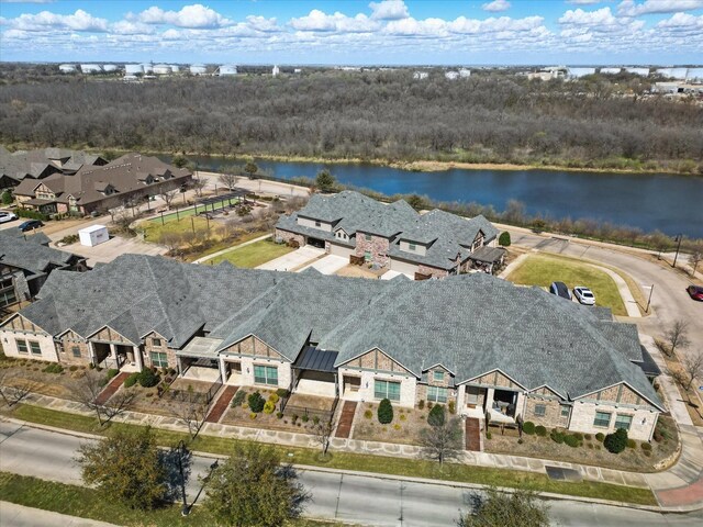 birds eye view of property with a water view and a residential view