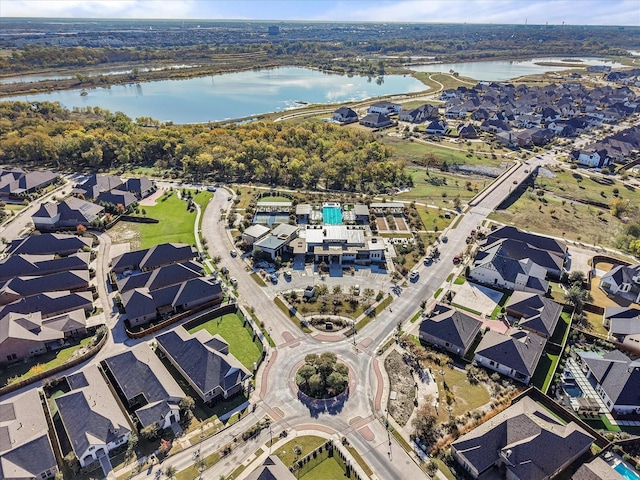 bird's eye view featuring a residential view and a water view