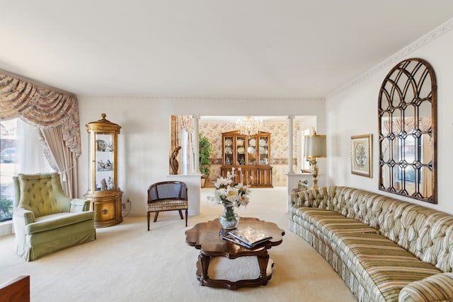 carpeted living room featuring a chandelier